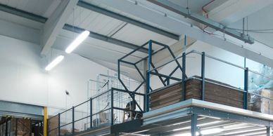 An up and over pallet safety gate on a storage mezzanine at a London distribution centre.