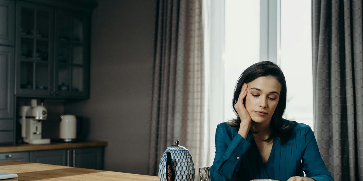 Woman sitting alone by the table