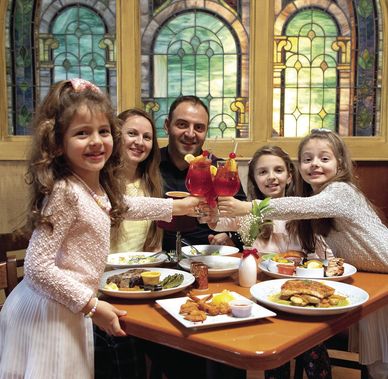 Happy family at Carolina Seafood and Steak restaurant