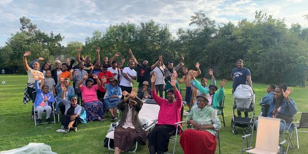 A group of people their hands up