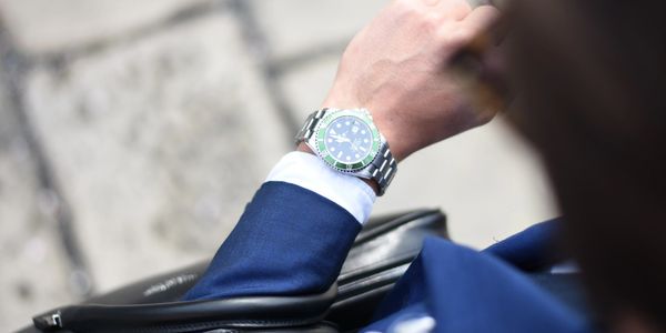 The view of someone's wrist and their wristwatch