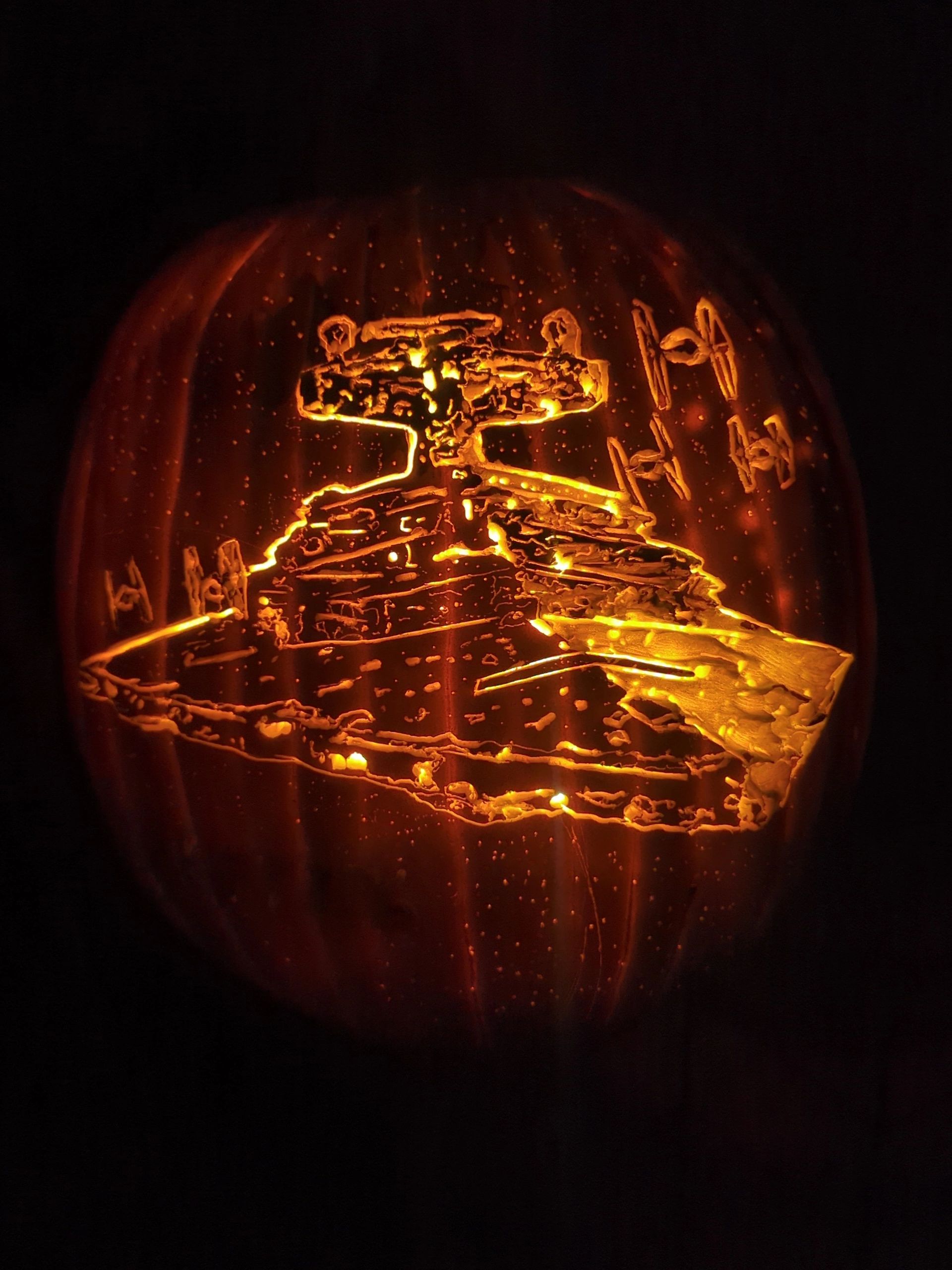 Star Wars themed pumpkin carving glowing in the dark.