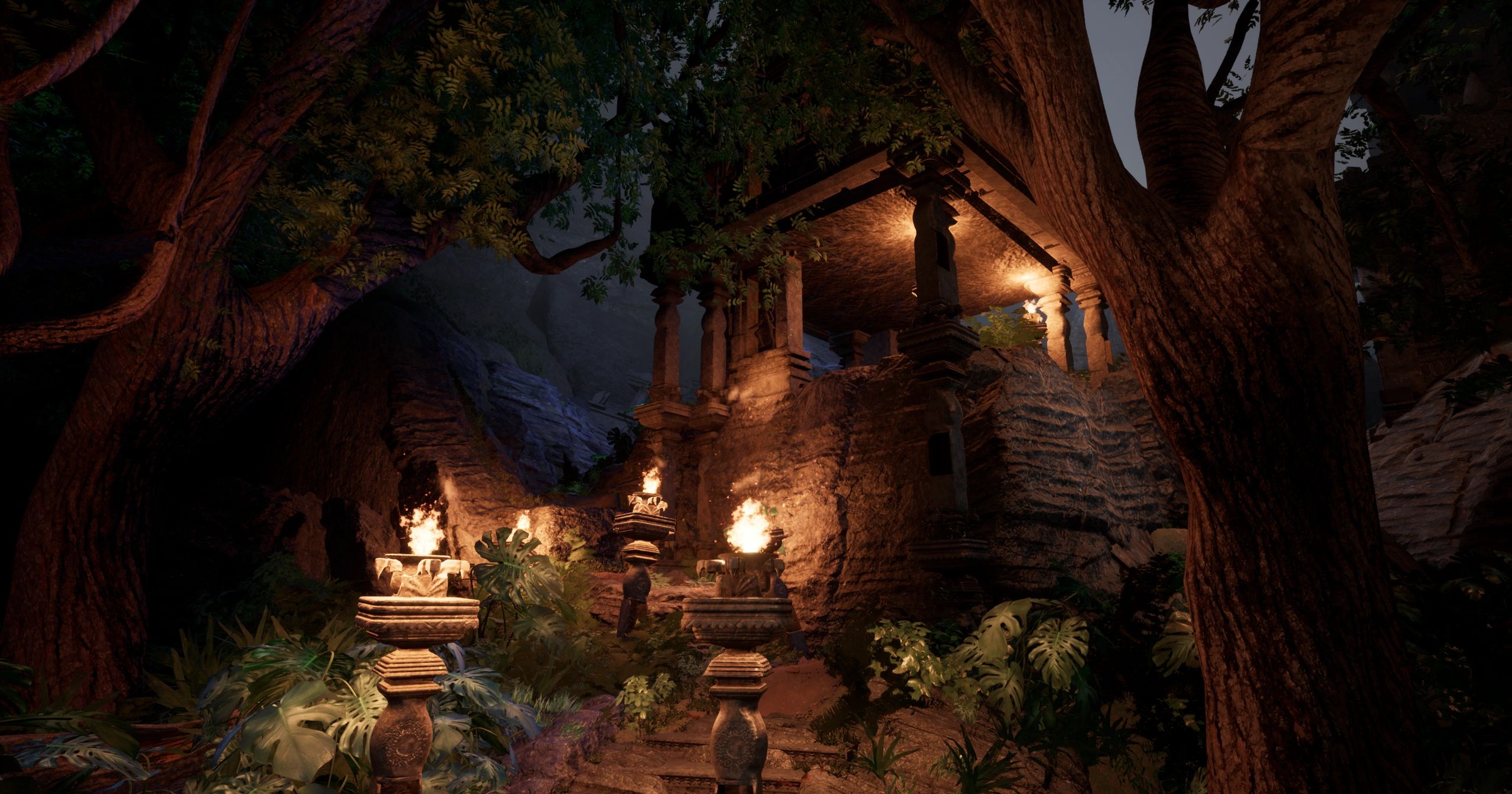 Ancient stone temple illuminated by torches in a dense forest at night.