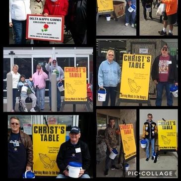 Volunteers holding signs and buckets for Christ's Table charity event.