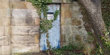 Blue door to expertise, closed distillery, Scotland
