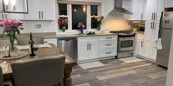 Fully remodeled kitchen featuring modern cabinetry, updated appliances, and sleek countertops