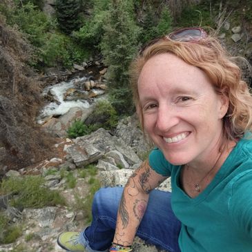 picture of erin on a rocky hill