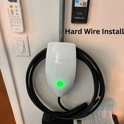 Hardwired Tesla Wall Connector installed by Wanner Electric LLC.  Level 2 home charging setup. 