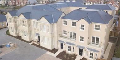 New roof at St Marys Court Lowestoft. All new natural slates on the main roof with hips and valleys