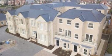 Natural slate roof at Kirkley Clyffe, Lowestoft. New roof with valleys and hips and lead bay roofs.