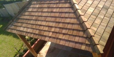 Cedar shingle roof in Lowestoft. Garden roof in wood shingles.