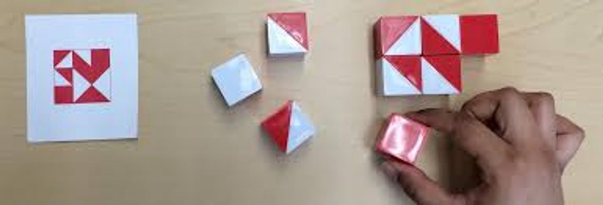 Red & White blocks, being arranged on a table based on a design like in IQ testing. 