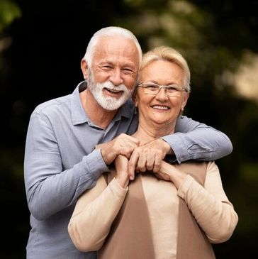 Senior husband and wife hugging. Representing Reverse Mortgage, mortgages.
