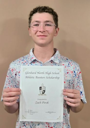Young man holding a scholarship certificate from Glenbard North High School.