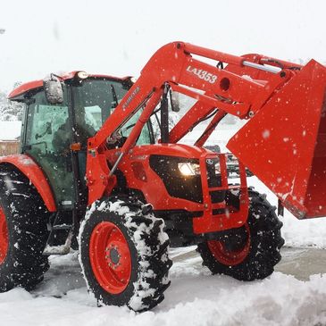 snow plowing kubota tractor 