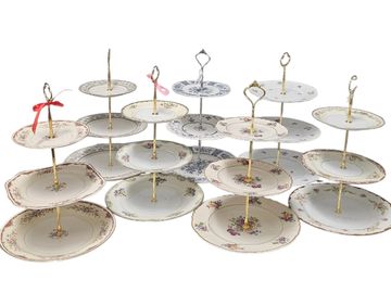 A collection of elegant tiered serving trays made from vintage china plates.
