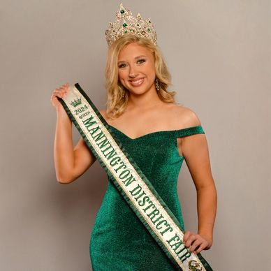 Woman wearing a crown and sash for Mannington District Fair 2024.