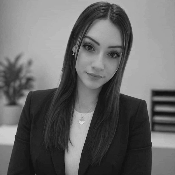 Professional woman with long hair in a business setting.