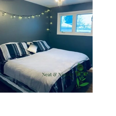 Clean, cozy bedroom with striped bedding, fairy lights, natural light, and Neat & Nimble logo.