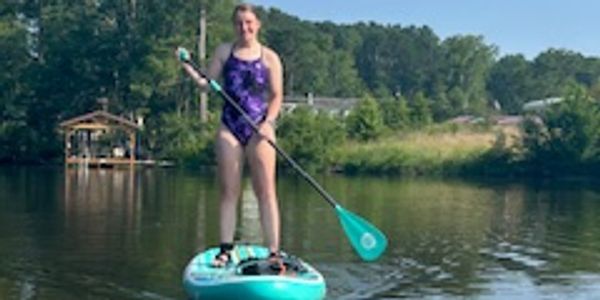 Kassidy enjoying a morning on the paddle board