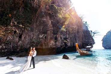 Romantic wedding moment captured on the shores of Phi Phi Islands, Thailand.