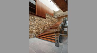 Atrium Stair, Luckstone, walnut stairs treads with powder coated steel and glass railing