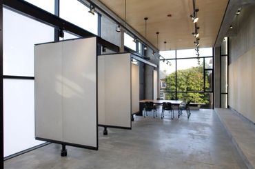 Swiveling pin up walls and cantilevered table at University of Virginia's Campbell Hall 