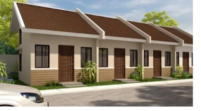 Row of small modern houses with brown roofs.