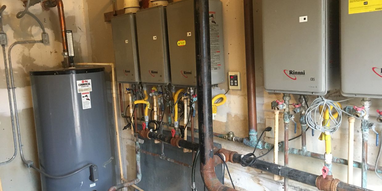 Bryan TX  commercial boiler application using Rinnai heaters circulation system with storage tank.