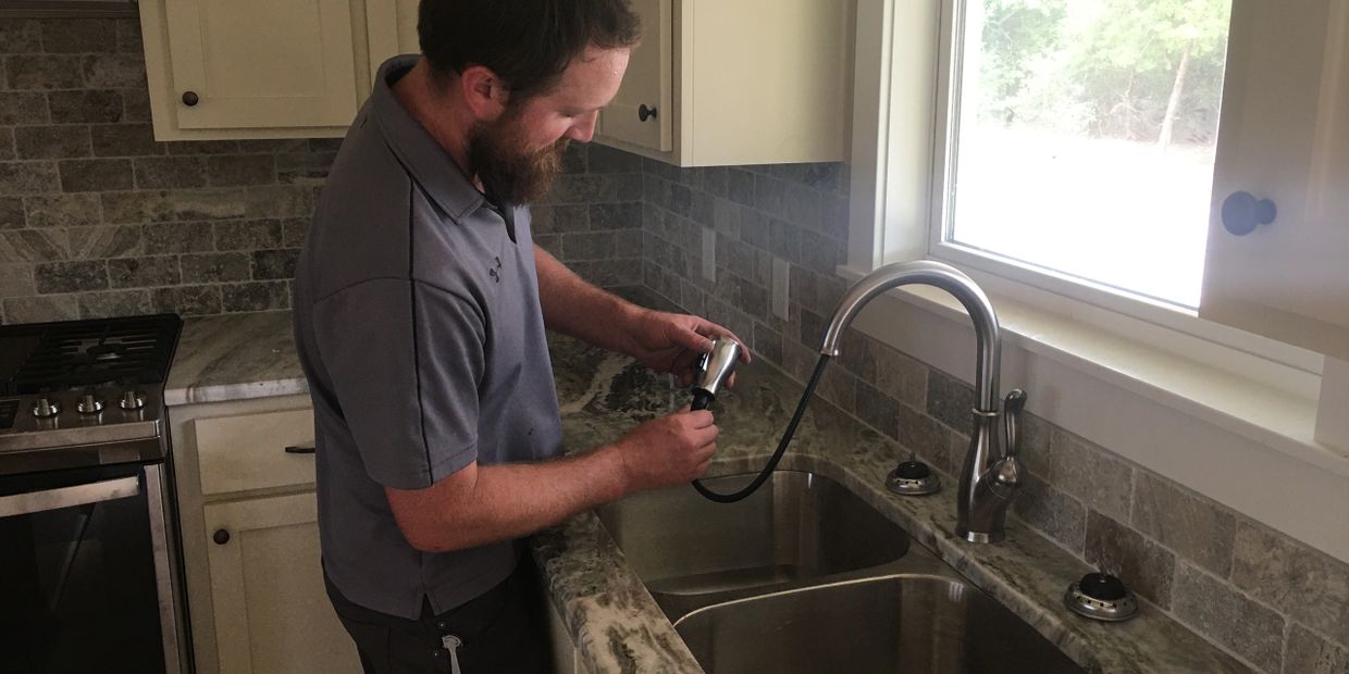 Brazos valley kitchen plumbing repair of a Delta pull-down faucet. Done by a licensed plumber.
