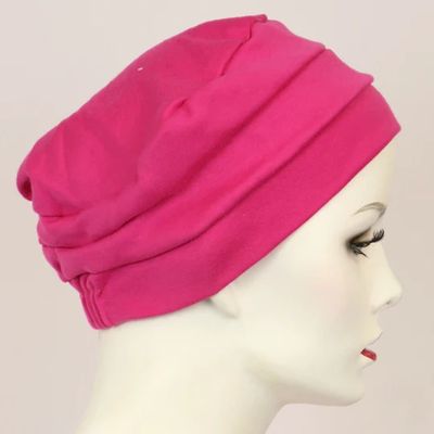 3-seam cotton turban in fuchsia displayed on a woman's mannequin head