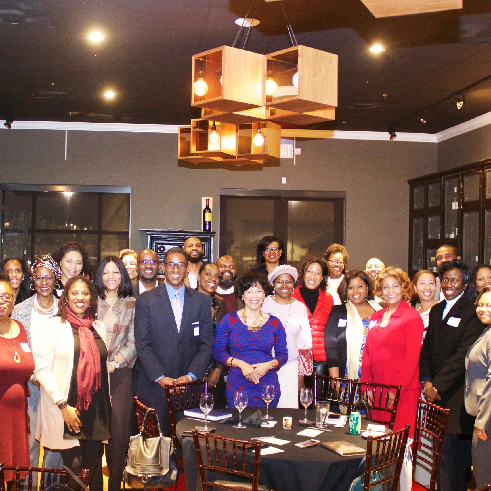 Group of Black people attending BPH reception standing posed for this photo.