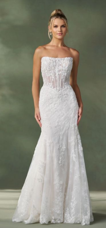 Elegant strapless white wedding gown with floral lace details.