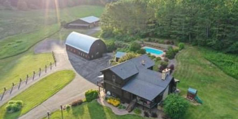 Features indoor/outdoor ceremony spaces, indoor reception, a log home with a pool. Stunning. 