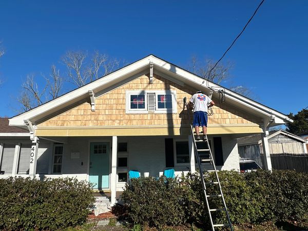 Cedar shake siding installation on a home 
