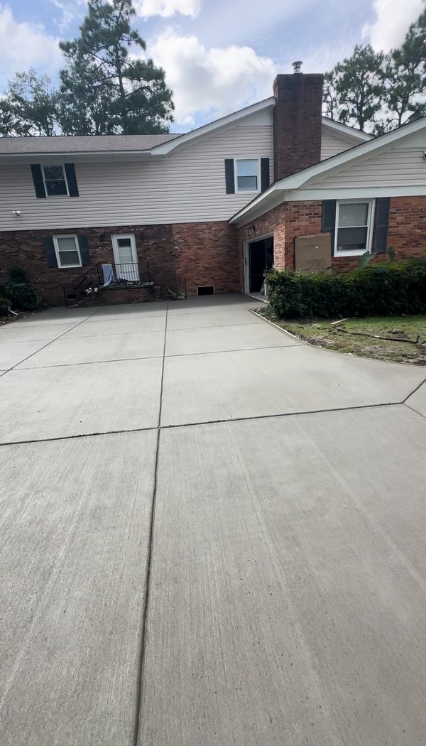 Freshly poured concrete slab and concrete driveway 