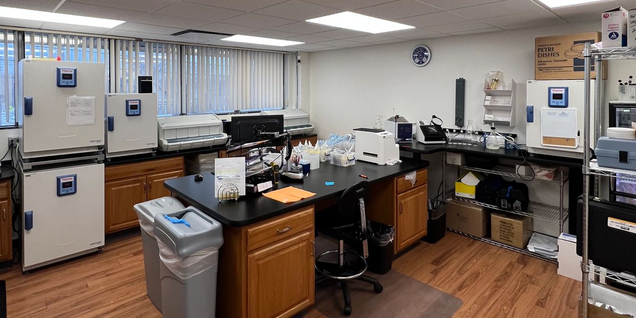 Clean and organized laboratory with equipment and storage.