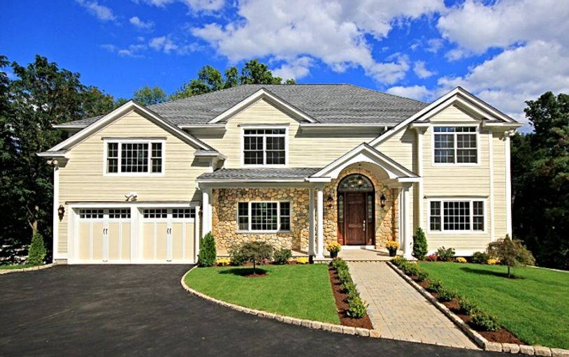  Large colonial house, green lawn.