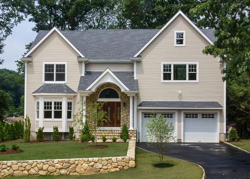 New house, stone retaining wall.








