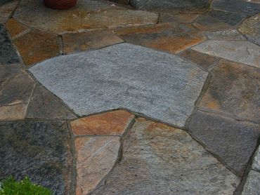 Close-up of large, irregular flagstone pieces laid for a path.