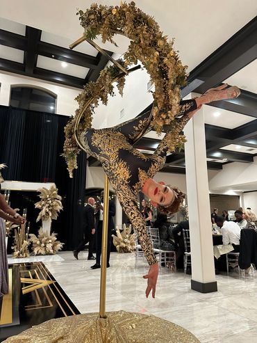 gold aerial lyra performance, gold aerial spiral event entertainment