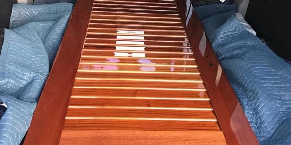 Polished wooden xylophone or marimba with padded protection.
