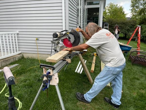 One of Benmar's trained, professional installers working on a sunroom project.