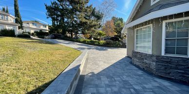 Gray pewter pavers in a large driveway.