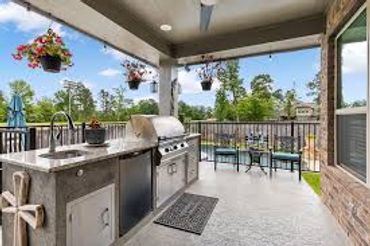 Outdoor kitchen in a backyard patio.