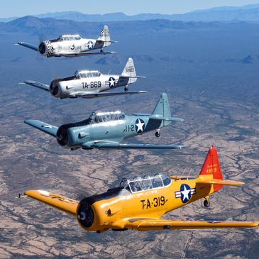 Four T-6 Texans flying in formation with Legends Warbird Rides in Goodyear, AZ and Afton, WY