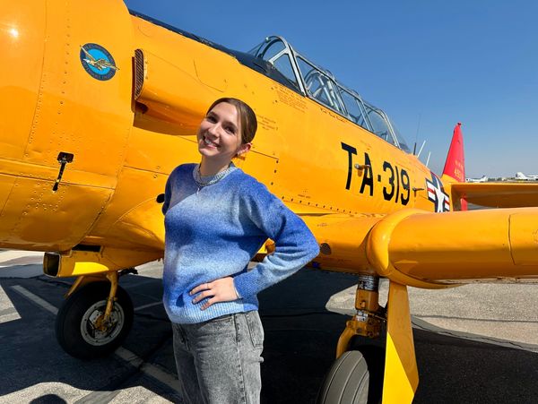 A happy woman after flying in the T-6 Texan 