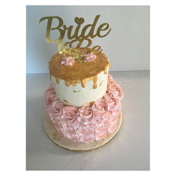 Two tier bridal shower buttercream cake with gold drip and pink rosettes