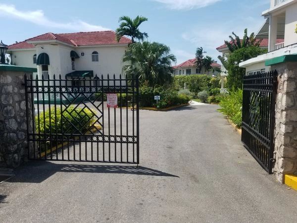 Entrance to Piper's Cove Resort in Runaway Bay. Villa-style setting.