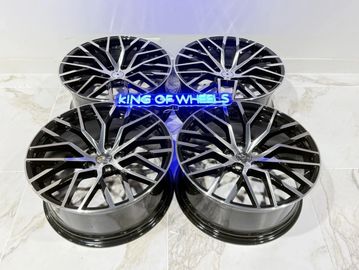 Set of four stylish black alloy wheels with a modern spoke design.